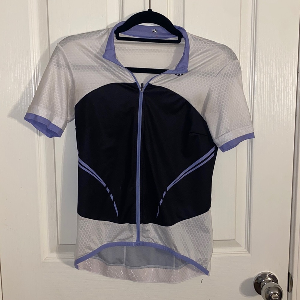 White, purple, and black woman cycling Jersey